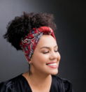 a person with a red flower crown